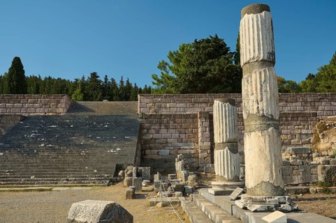 Ruins with broken columns and stone steps under a blue sky, Asklepios Temple, Asklipion,