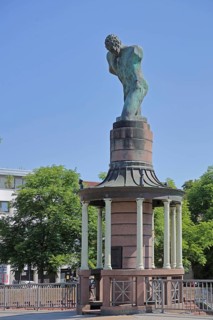 Sculpture raftsman by Rob Krier 1989, monument to the historical tradition of rafting on the river