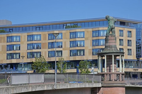 Sculpture raftsman by Rob Krier 1989, monument to the historical tradition of rafting on the river