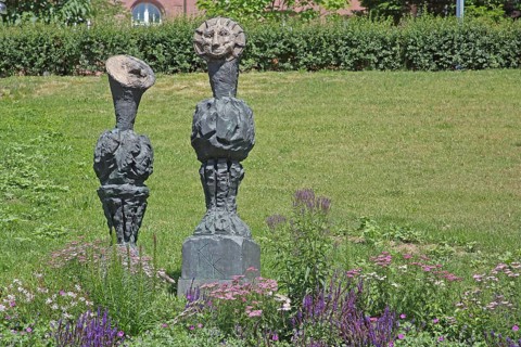 Sculpture Sun and Moon by Markus Lüpertz 2017, modern art, bronze sculpture, two faces, moon face,