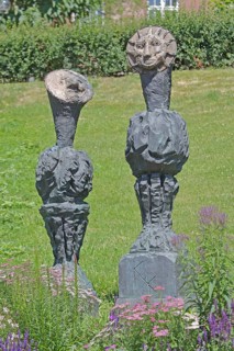 Sculpture Sun and Moon by Markus Lüpertz 2017, modern art, bronze sculpture, two faces, moon face,