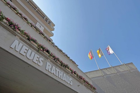 New town hall with three flags, modern building with inscription, national flag, Baden-Württemberg