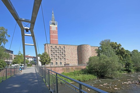 City church built in 1968 and quail footbridge over the Enz, pedestrian bridge, arch bridge,