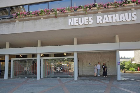 Entrance to the New Town Hall, modern building with floral decoration and inscription, new,