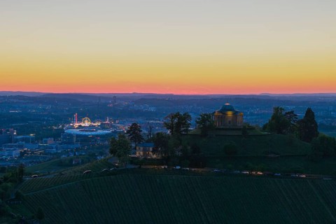 View of a chapel and town at sunset, with lights and vineyards, grave chapel, Zum Württemberg,