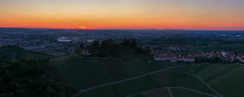Panoramic view of the city with vineyards and houses in the foreground at sunset, grave chapel, Zum