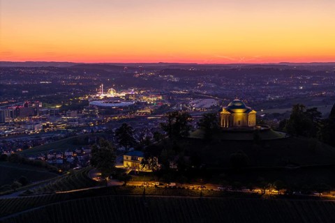 Chapel on the hill with city lights in the background, at sunset, grave chapel, spring festival,