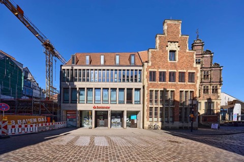 Contrast, modern versus historical architecture, brick building, branch of Santander, facade,