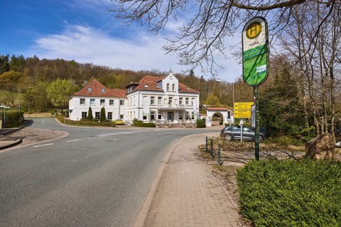 Hotel and restaurant Wittekindsquelle, building, bus stop church, pavement, concrete paving stones,