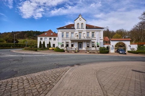 Hotel and restaurant Wittekindsquelle, building, pavement, concrete paving stones, asphalt road,