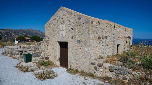Chapel Agios Nikolaos, Old stone house in Mediterranean landscape with clear blue sky in the
