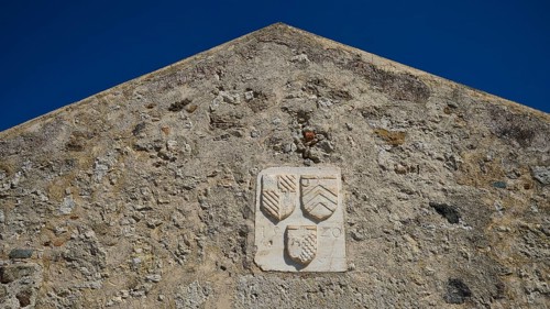 Coat of arms of the Grand Master del Carretto, Relief with coat of arms on the façade of an old