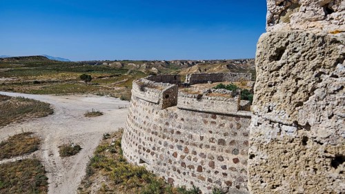 Bastion, Defence walls, Massive stone fortifications in a dry, extensive landscape, Antimacheia,