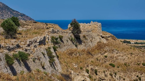 Weathered ruins on a dry coastal hill overlooking the sea, Antimacheia, Medieval fortress, St