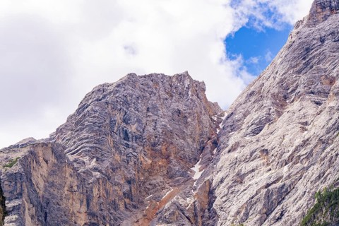 Stony mountain landscape under a blue sky with scattered clouds, Alpe di Siusi, South Tyrol,