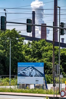 Construction site sign for thyssenkrupp Steel's first direct reduction plant, the climate-neutral