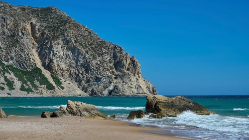 Beach, Kavo Paradiso, Paradise Beach, beach with rocky coast and clear blue sky by the sea,
