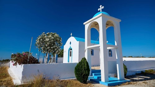 Chapel of Agios Charalambos, chapel with cross and bell tower in a natural setting, Kefalos, Kos,