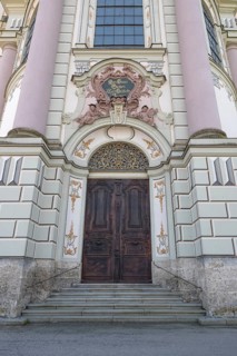 Side entrance portal of the east tower of the baroque Basilica of St Alexander and Theodor,