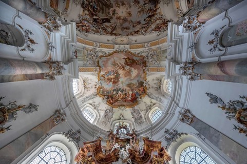 Vault with ceiling fresco above the chancel in the baroque Basilica of St Alexander and Theodor,