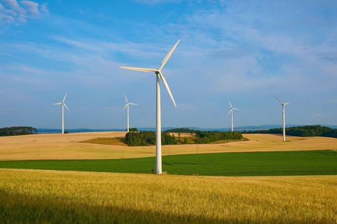 Wind turbines in a wide, green landscape under a clear sky, summer, Höhefeld, Wertheim,