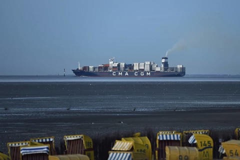 Large container ship... Elbe fairway through the Wadden Sea of the North Sea off Cuxhaven, view