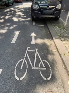 A cycle path on which a car park is marked for cars, Wuppertal, Germany