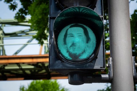 Portrait of Friedrich Engels on a pedestrian traffic light in Wuppertal, Germany