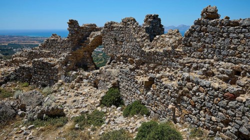 Stone ruins overlook a vast landscape under a clear sky, Abandoned Village, Lost Place, Pyli, Paleo