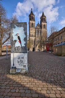 Part of the Berlin Wall, memorial to the fall of the Berlin Wall, cathedral, blue sky, cumulus