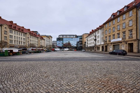 Old town, sandstone building, modern architecture, glass facade, cobblestone square, weekly market