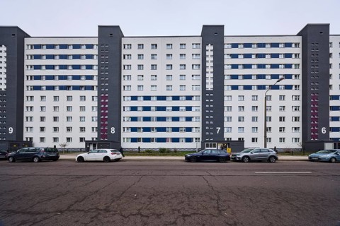 High-rise building, residential building, residential silo, façade with windows, car park with
