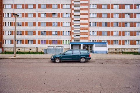 High-rise building, residential building, facade, window, door, parking lane, vehicle, lantern,
