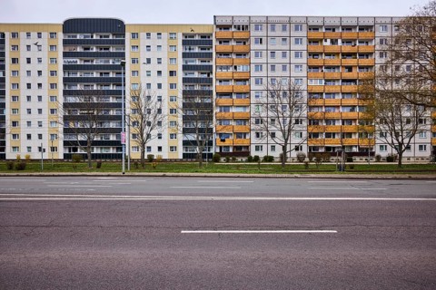 Residential building, high-rise buildings, facade, window, balcony, bare wintry trees, lantern,