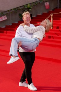 Jens Knossi Knossalla with girlfriend Lia Mitrou (influencer) at the German premiere of the