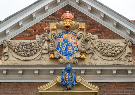 Royal Coat of Arms architectural detail, College of Matrons building, Salisbury, Wiltshire,