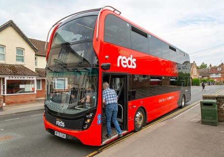 Passengers boarding Salisbury Reds double decker bus service X5 at Pewsey, Wiltshire, England, UK