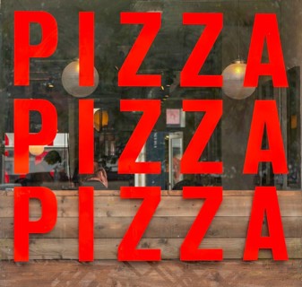 Pizza PIzza Pizza sign restaurant window, nole on the square, Salisbury, Wiltshire, England, UK