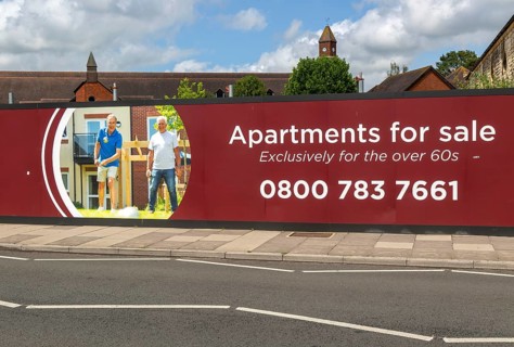 Apartments for sale for over 60s advertising hoarding, Churchill Retirement Living, Salisbury,
