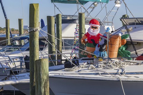 Inflatable Christmas decorations on the deck of a boat at the Biloxi Small Craft Harbor in Biloxi,