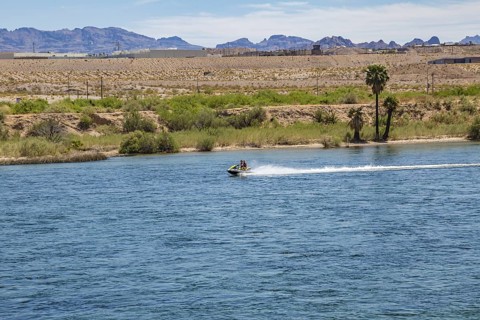 Tourists riding jet skis on the Colorado River in Laughlin, Nevada