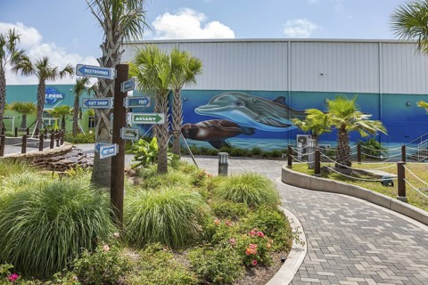 Sign directs guests to different attractions at Ocean Adventures Marine Park in Gulfport,