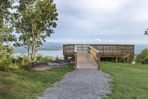 Wooden deck overlooks Weiss Lake at Cheyenne Rock Village near Leesburg, Alabama
