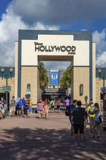 Entrance to Disney's Hollywood Studios theme park with sign mandating masks to contain the spread