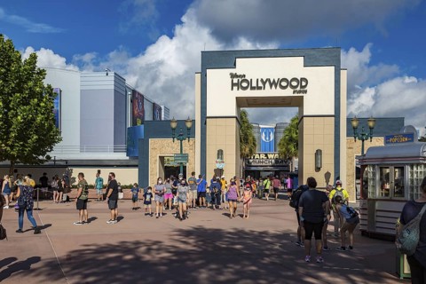 Entrance to Disney's Hollywood Studios theme park with sign mandating masks to contain the spread