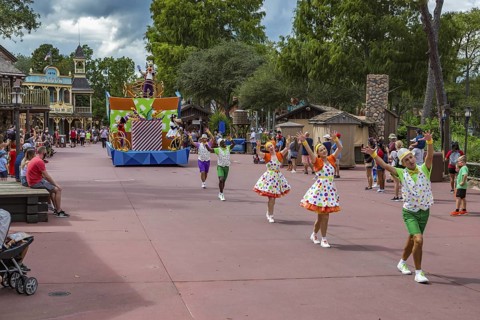 Parade of dancers and characters in the Frontierland area of Magic Kingdom at Walt Disney World,