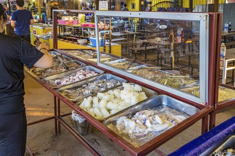 Selection of raw seafood available for customers at a buffet style outdoor restaurant in Chiang Rai