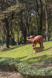 Statue of an elephant with a ball on the campus of CRRU Shiangrai Rajabhat University in Chiang