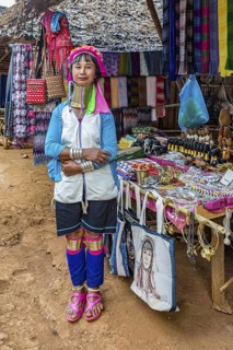 Tribal woman selling woven scarves and other crafts in the Long Neck Karen tribe (more properly