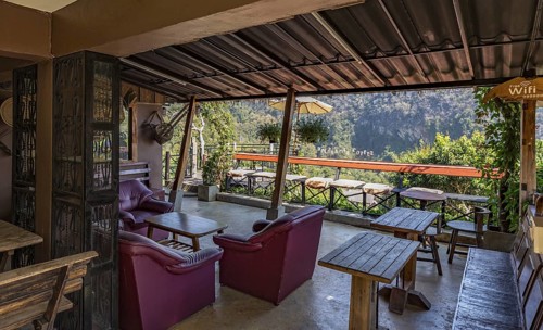 Stairs lead down to the Doi Phamee coffee shop and restaurant in Mae Sai district of Chiang Rai,